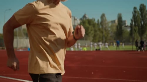 Caucasian Old Man Runner Elderly Male Run in City Stadium Outdoors Jogging Healthy Lifestyle