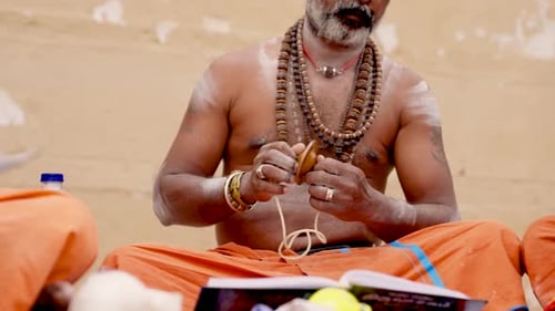 Indian Priest Praying with Clash Cymbals