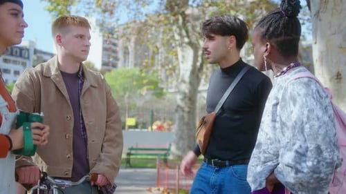 Company of Joyous Friends Chatting in the Park after College