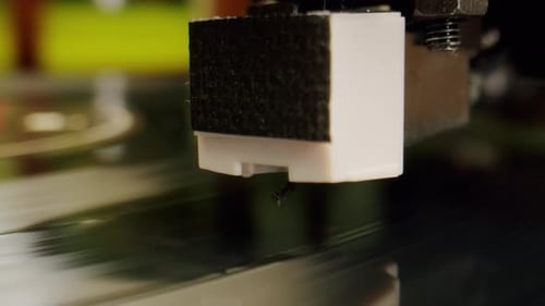 Record Player Stylus on Spinning Vinyl Record Close-up