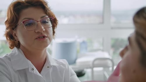 Cosmetologist Consulting Woman Facial Procedures Close Up