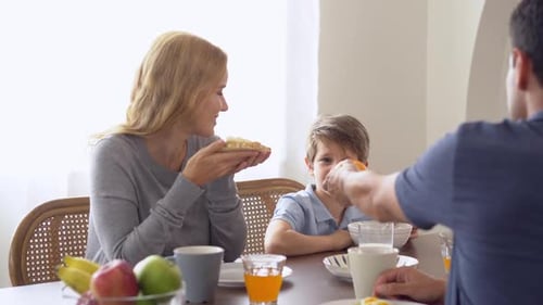 Family Enjoying Breakfast Together at Home