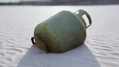 Old Rusted Metal Gas Tank on the Beach