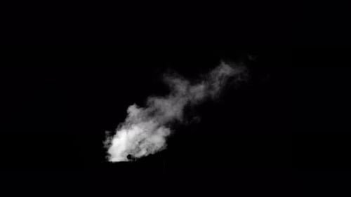 Fume Collection: Steam seen sprouting out from a pipe on a black background, shot in 4k