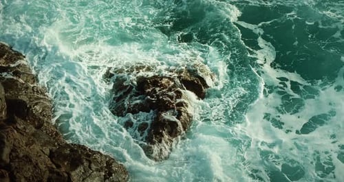 Sea Waves Crush on Rocky Shore