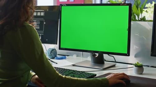 Woman Working at Desk with Chroma Key Computer