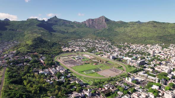The citadel and port louis in mauritius, lush mountains surrounding ...