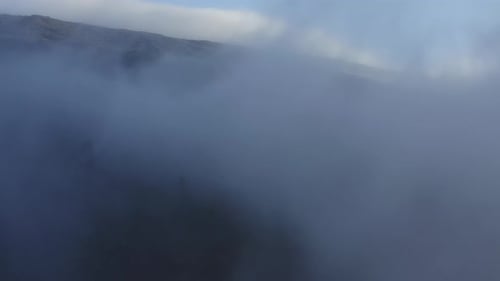 Aerial view of clouds moving over the slopes of Haleakala volcano on Maui, Hawaii.