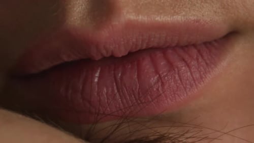Close-up of young Caucasian female's lips