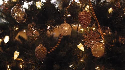 Ornate Christmas Tree With Lights And Golden Baubles