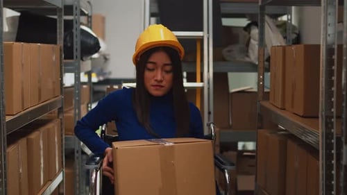 Depot Employee with Disability Taking Boxes Off of Racks