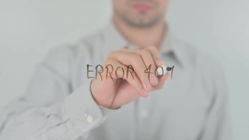Hand Writing Error 404 with Marker on Glass