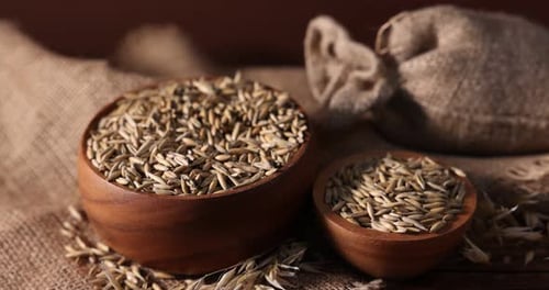 Wooden Bowls of Grain on Rustic Burlap