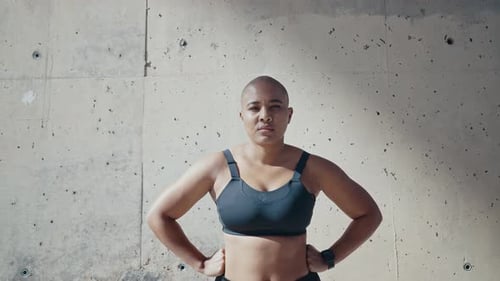 shaved woman making sport outdoor.