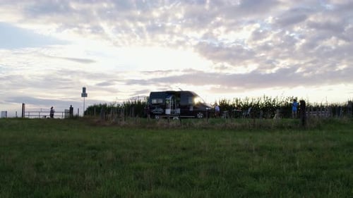 Aerial view of countryside with camper at sunset, Netherlands.