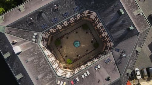 Captivating aerial drone footage showcasing the unique octagonal courtyard of a historic building in
