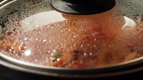 Spaghetti with vegetables simmering in tomato sauce