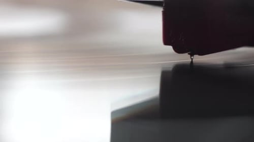 Crystal Gramophone Needle on Spinning Vinyl Record, Close Up