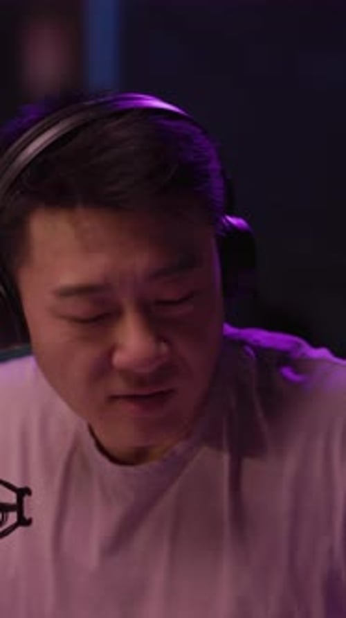 Passionate Vocalist Singing into Microphone at Night