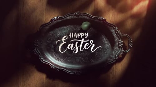 Happy Easter text on tray with rolling green egg.