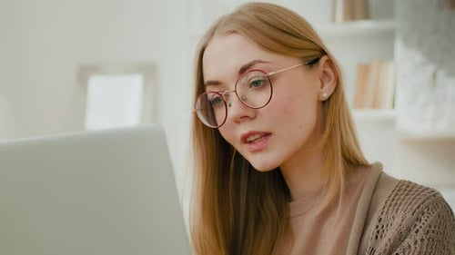 Young Woman Working On Laptop From Home