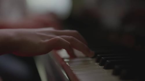 Hands Playing Piano Keys Close Up