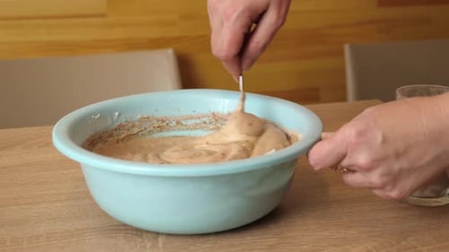 22sm. Preparation of pastry dough with the addition of cocoa. Making a sweet cake. Slow motion.