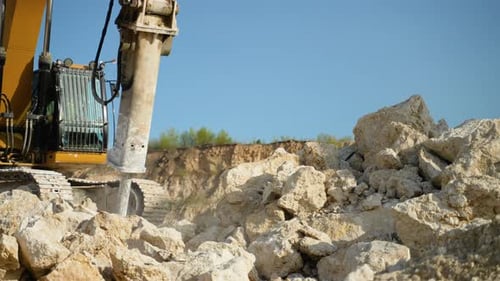 Yellow Drilling Machine Performs Drilling Work in a Quarry