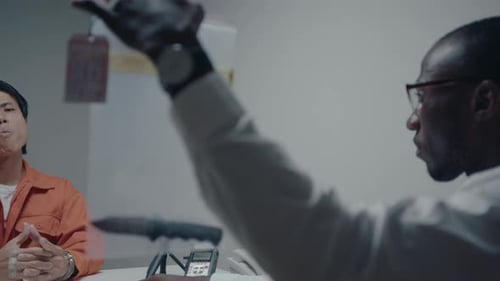 Detective Showing Bloody Knife in Evidence Bag and Interrogating Suspect