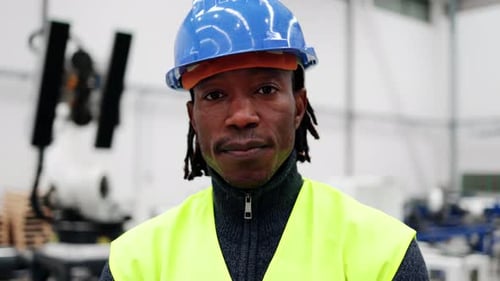 African engineer working at ai robotic automation warehouse - Industrial technology innovation