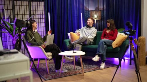 Three influencers recording podcast in a modern studio
