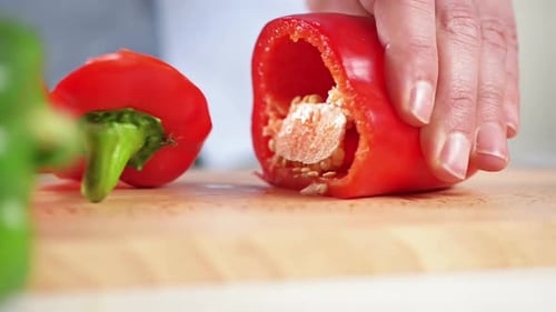 Close Up of Knife Slicing a Red Pepper