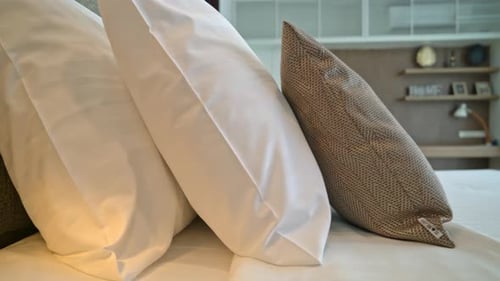 Comfortable Bed with Pillows in a Modern Bedroom