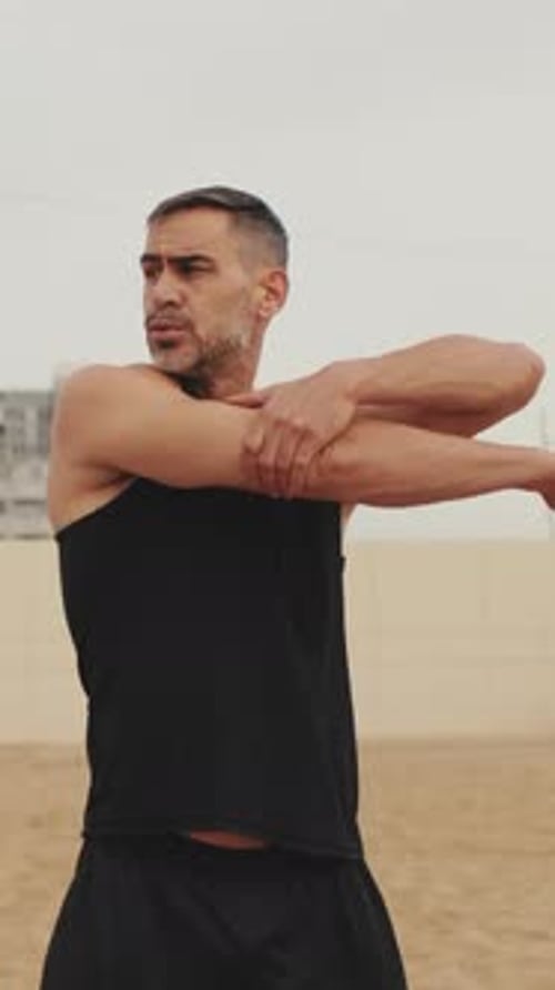 Man Stretching Arms Outdoors