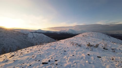 Snowy Mountains at Sunrise or Sunset