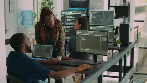 Software Developers Collaborating in a Modern Office Setting