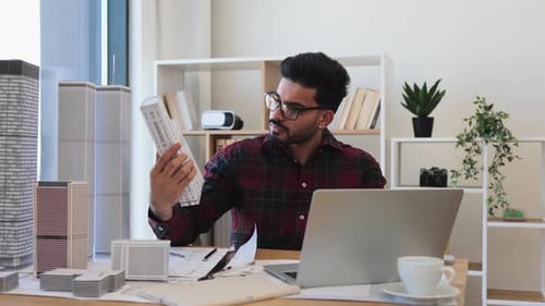Indian Architect Designing Urban Cityscape in Modern Office Space