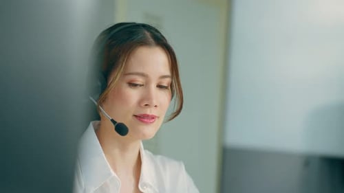 Asian beautiful business woman call center working in office workplace.