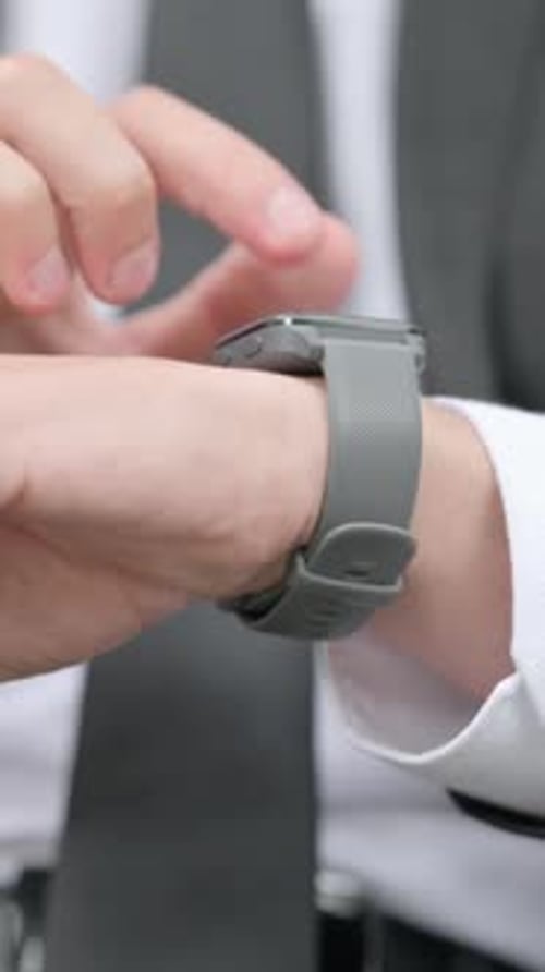 Close up of Businessman using Smart Watch, Vertical Video