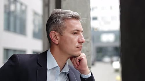 Thoughtful Businessman In Deep Thought At The Office