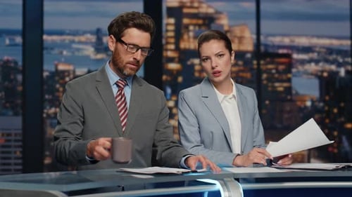 Serious Hosts Broadcasting News Late Studio Closeup Couple Newscasters Talking