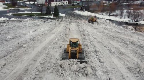 Snow plow, plowing in north america after a big winter storm