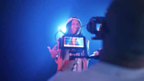 Young Female Rapper Singing and Recording Music Video