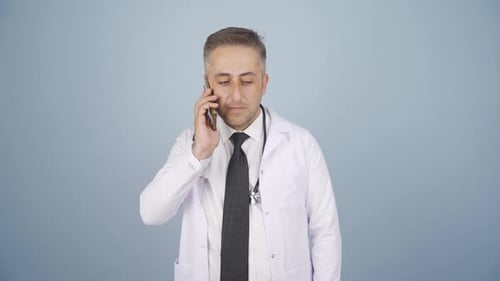 Doctor Talking on Smartphone in White Lab Coat