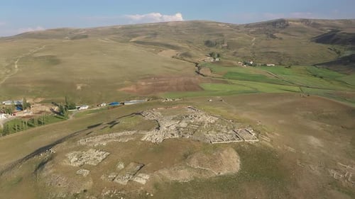 Aerial View Of Ancient City Green Meadow And Hills