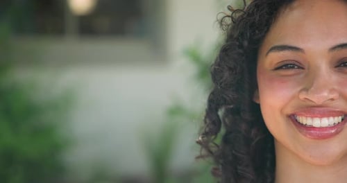 Woman Smiling and Laughing Close-Up in Urban Setting