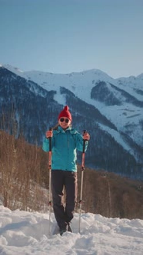 Young Adult Hiking in Snowy Mountains