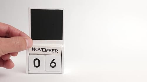 Hand sets calendar date to November 6th