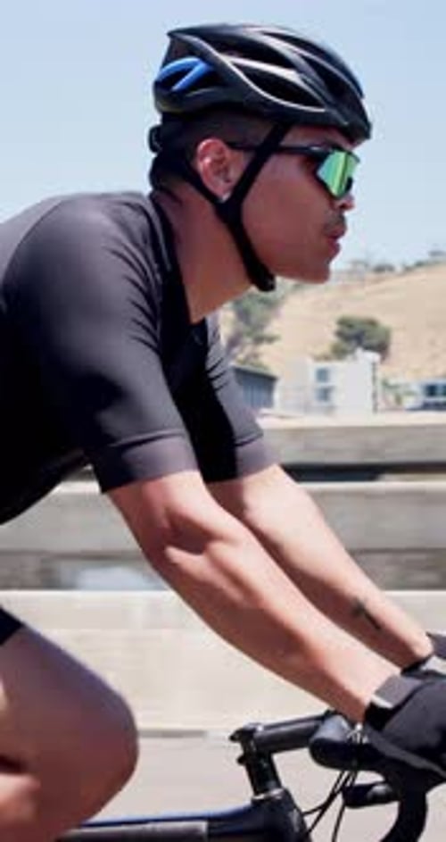 Workout, man or cycling on bike in city for cardio fitness, endurance challenge