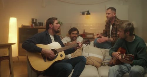 Friends Gather to Play Guitar at Home